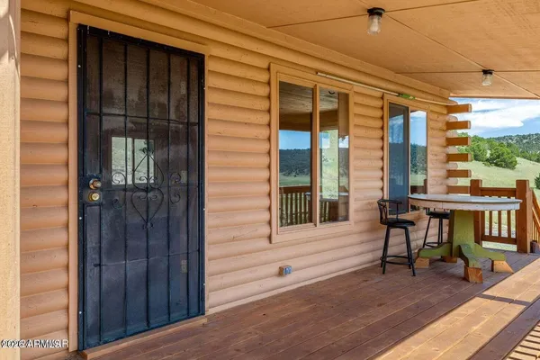 a view of a house with a porch and wooden floor