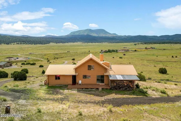 a aerial view of a house with a yard