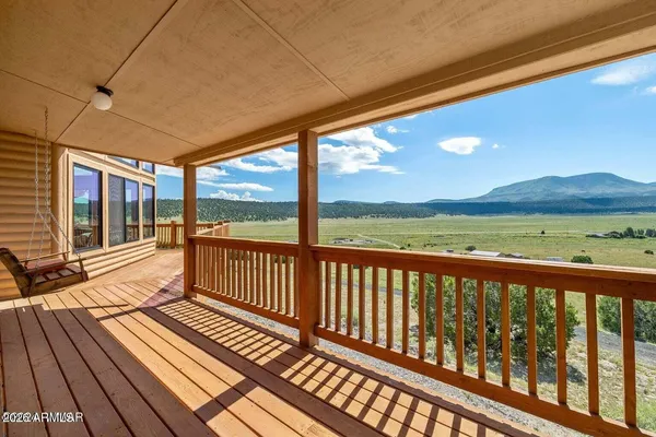 a view of balcony with wooden floor