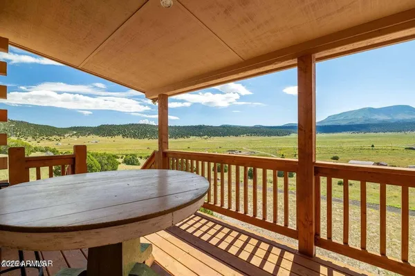 a view of a balcony with lake view and a ocean view