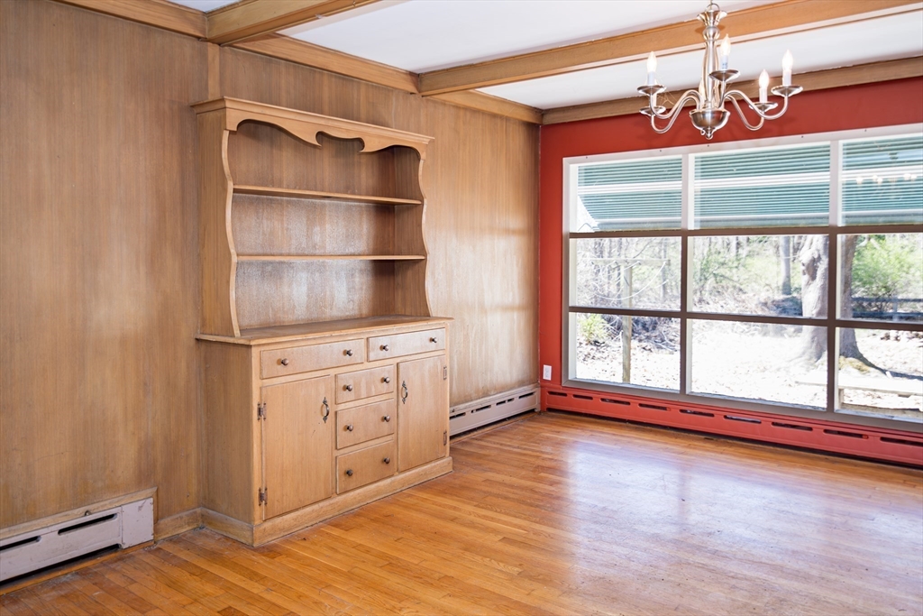 252 Thompson Road Webster, MA 01570 - Photo 11 of 39 a view of an empty room with wooden floor and a window