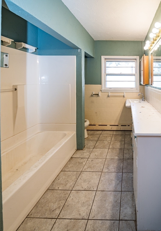 252 Thompson Road Webster, MA 01570 - Photo 31 of 39 a bathroom with a tub shower and window