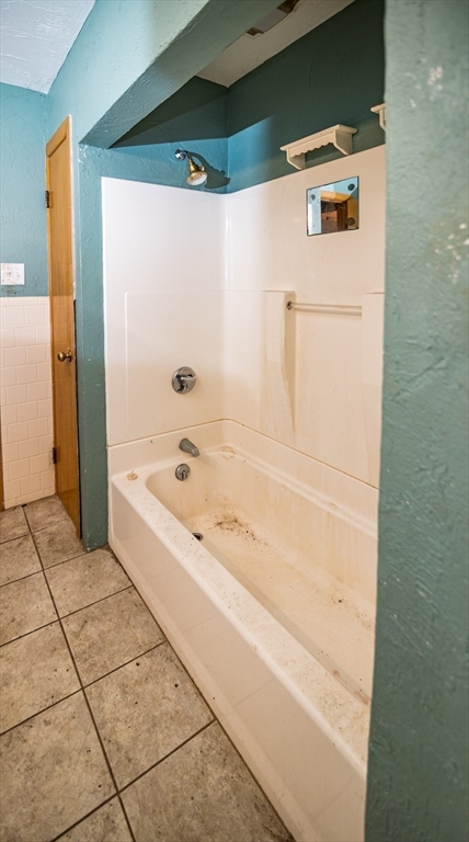 252 Thompson Road Webster, MA 01570 - Photo 32 of 39 a bathroom with a bathtub and a shower