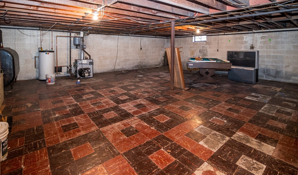 252 Thompson Road Webster, MA 01570 - Photo 33 of 39 a view of a storage room with wooden floor