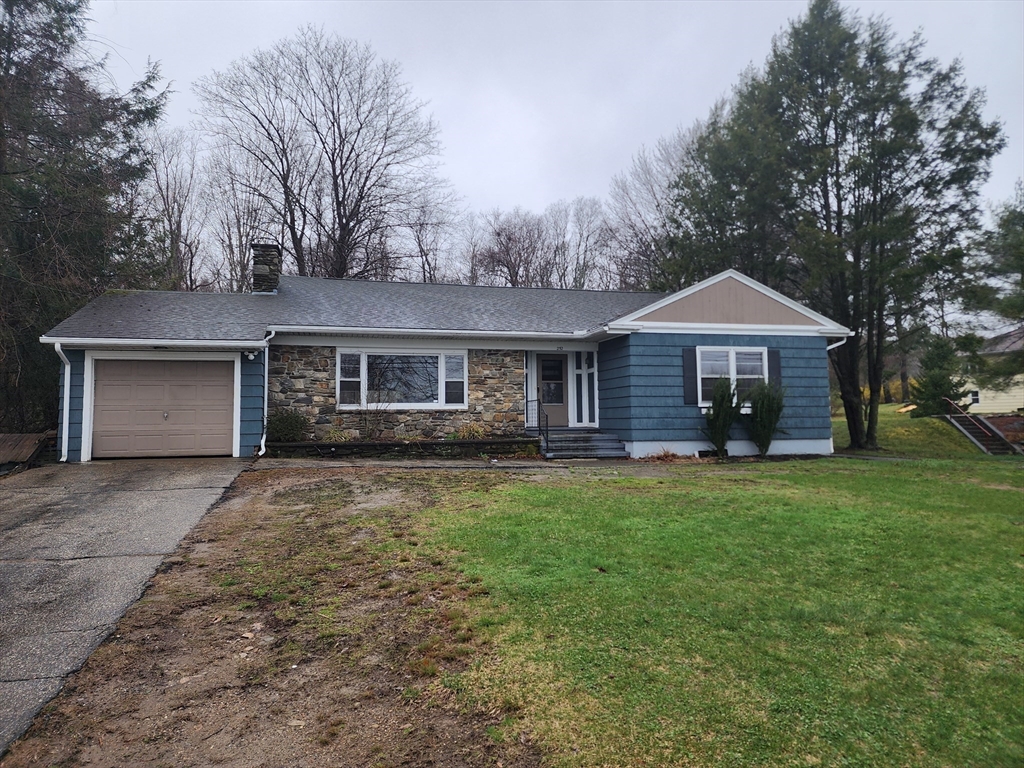 252 Thompson Road Webster, MA 01570 - Photo 37 of 39 a front view of a house with a garden and trees