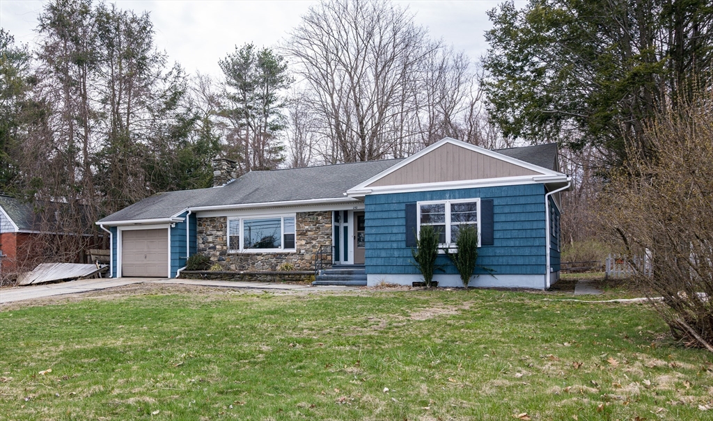 252 Thompson Road Webster, MA 01570 - Photo 5 of 39 a front view of a house with garden