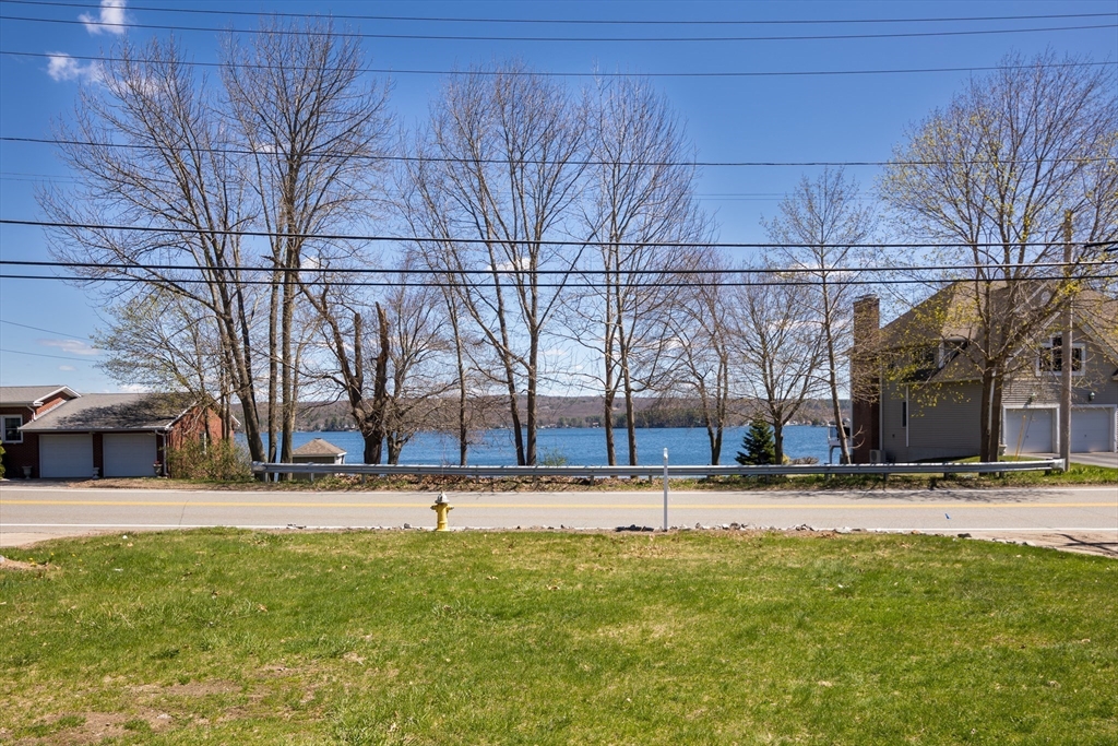 252 Thompson Road Webster, MA 01570 - Photo 6 of 39 a view of a yard with a tree