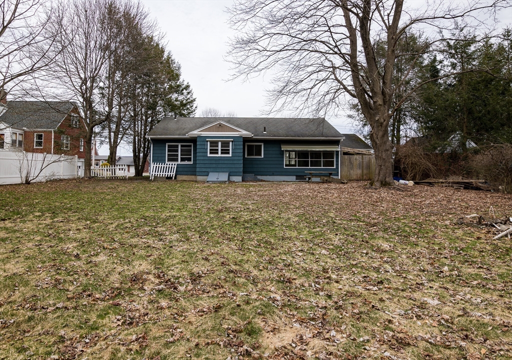 252 Thompson Road Webster, MA 01570 - Photo 8 of 39 a front view of a house with a yard