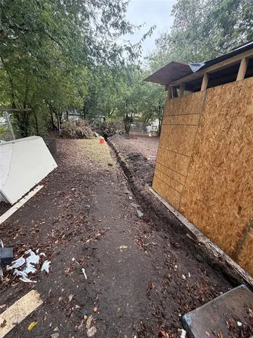 a view of a yard with an outdoor space