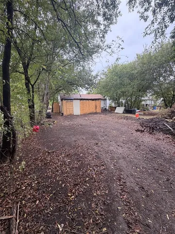 a backyard of a house with lots of green space