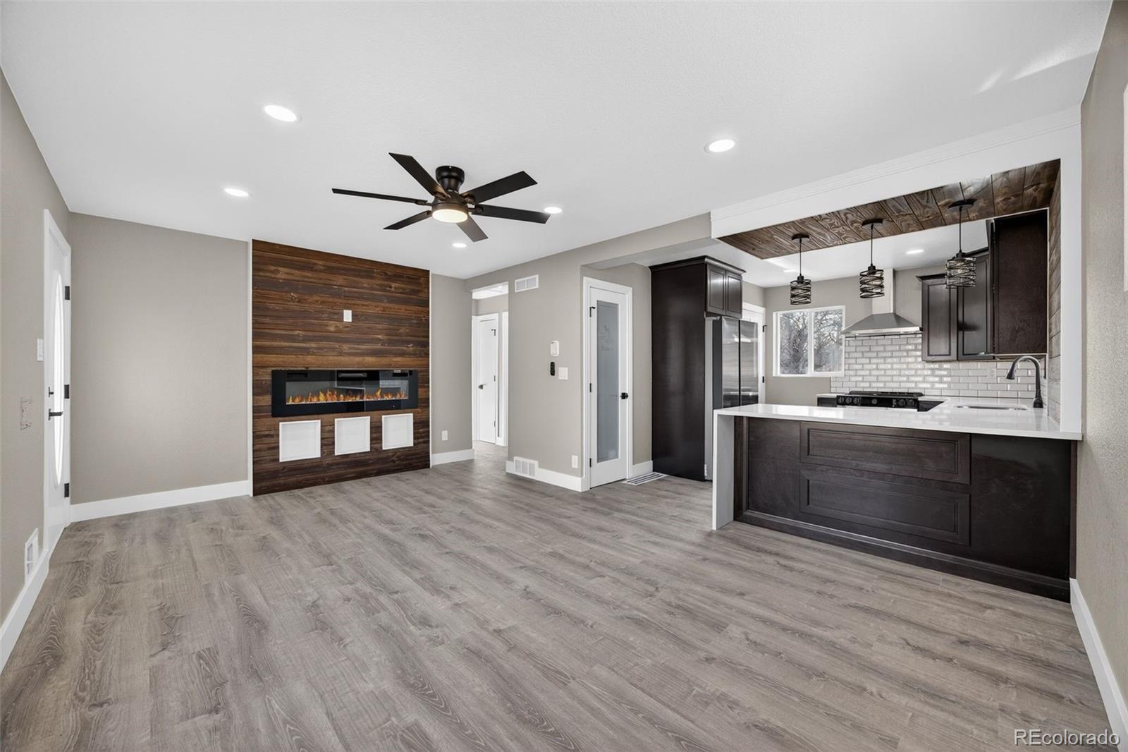368 Emery Road Northglenn, CO 80233 - Photo 19 of 28 a view of kitchen with stainless steel appliances kitchen island wooden floor and window