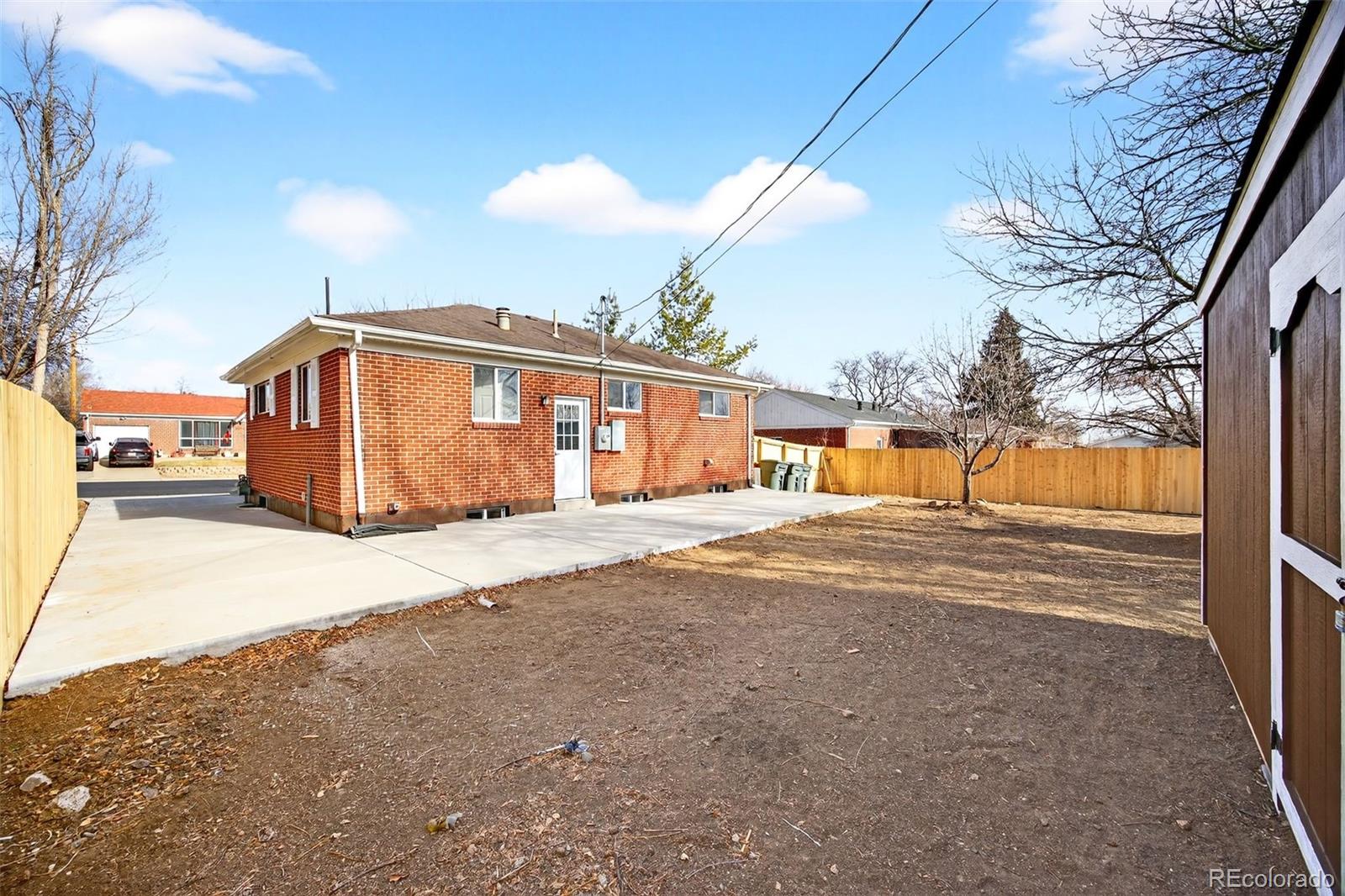 368 Emery Road Northglenn, CO 80233 - Photo 26 of 28 a view of a house with a snow on the road
