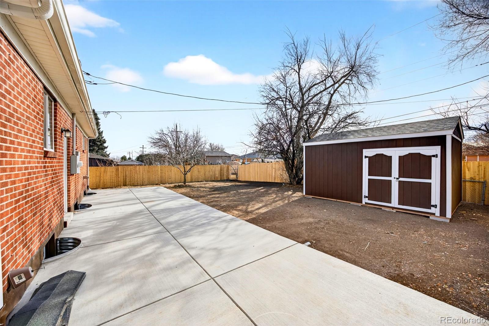 368 Emery Road Northglenn, CO 80233 - Photo 5 of 28 a view of a house with a yard