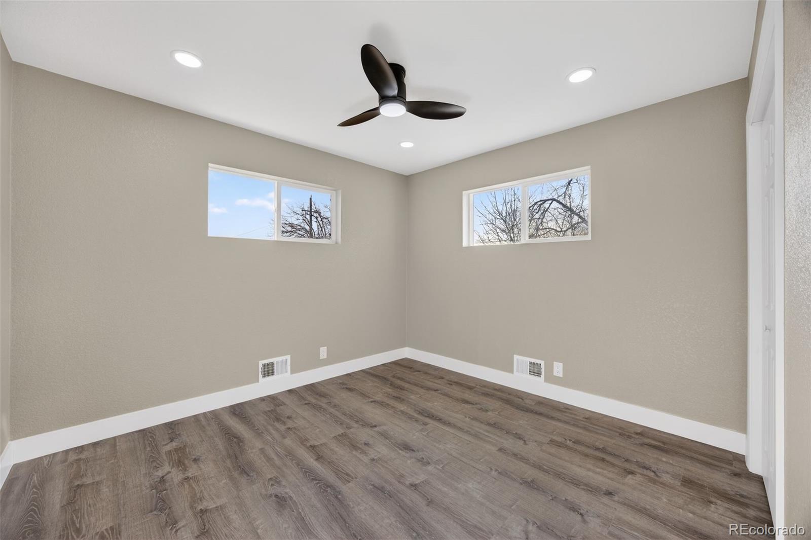 368 Emery Road Northglenn, CO 80233 - Photo 8 of 28 a view of empty room with wooden floor