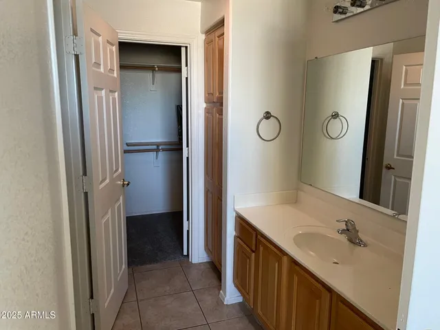 a bathroom with a sink and mirror