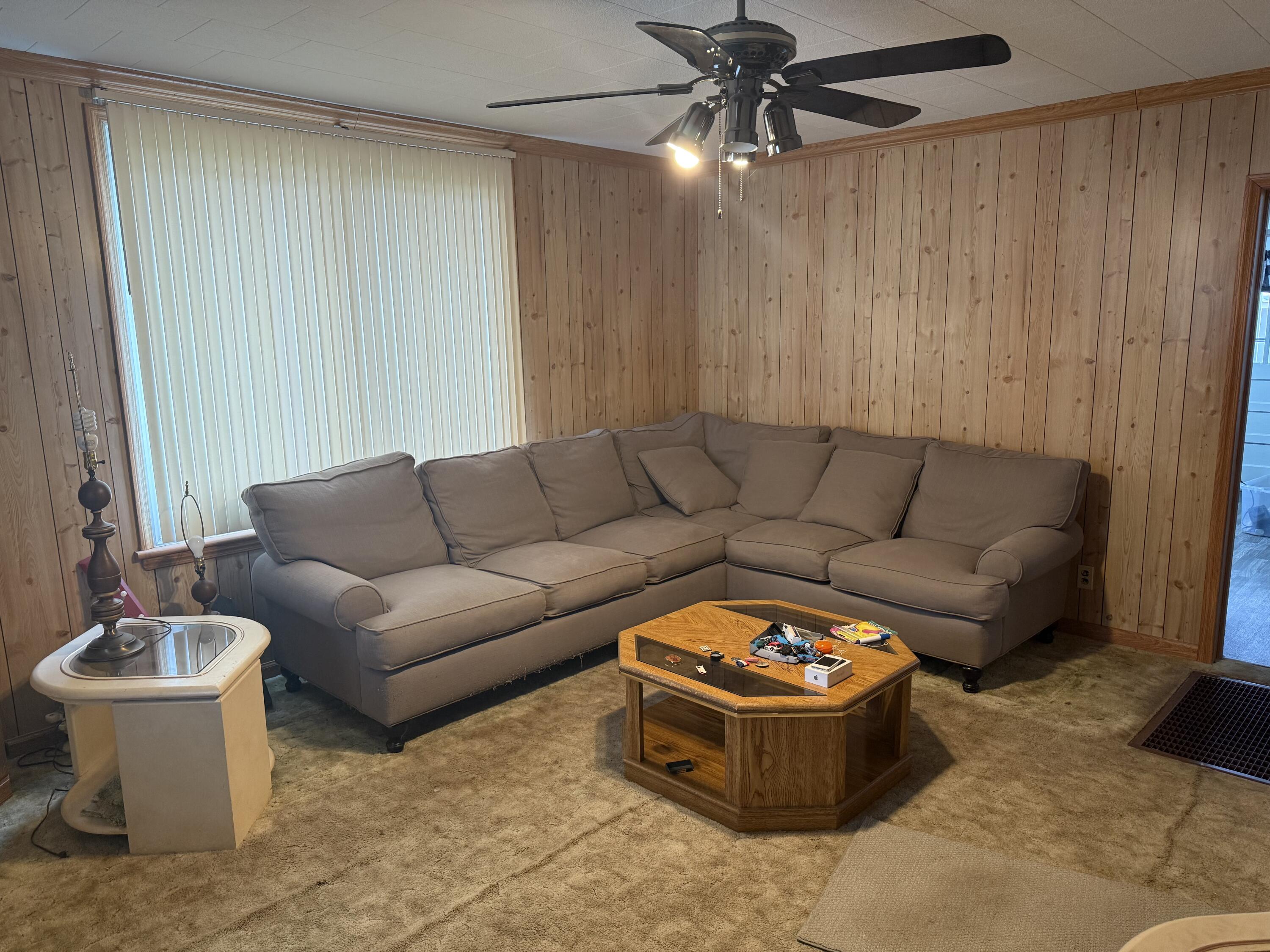 625 West Jackson Street Covington, VA 24426 - Photo 6 of 9 a living room with furniture and a chandelier