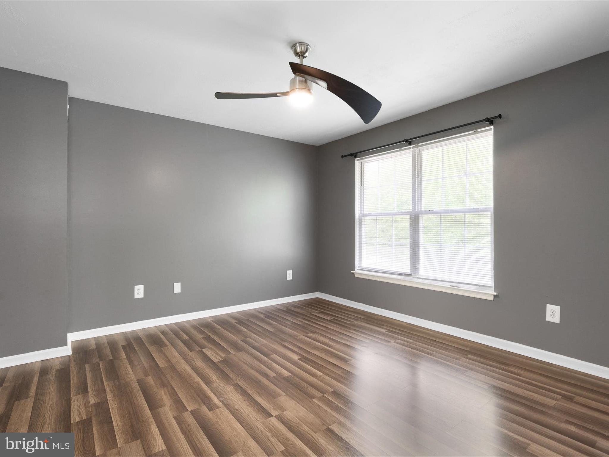 34 Dovetree Drive Newark, DE 19713 - Photo 15 of 29 a view of an empty room with wooden floor and a window