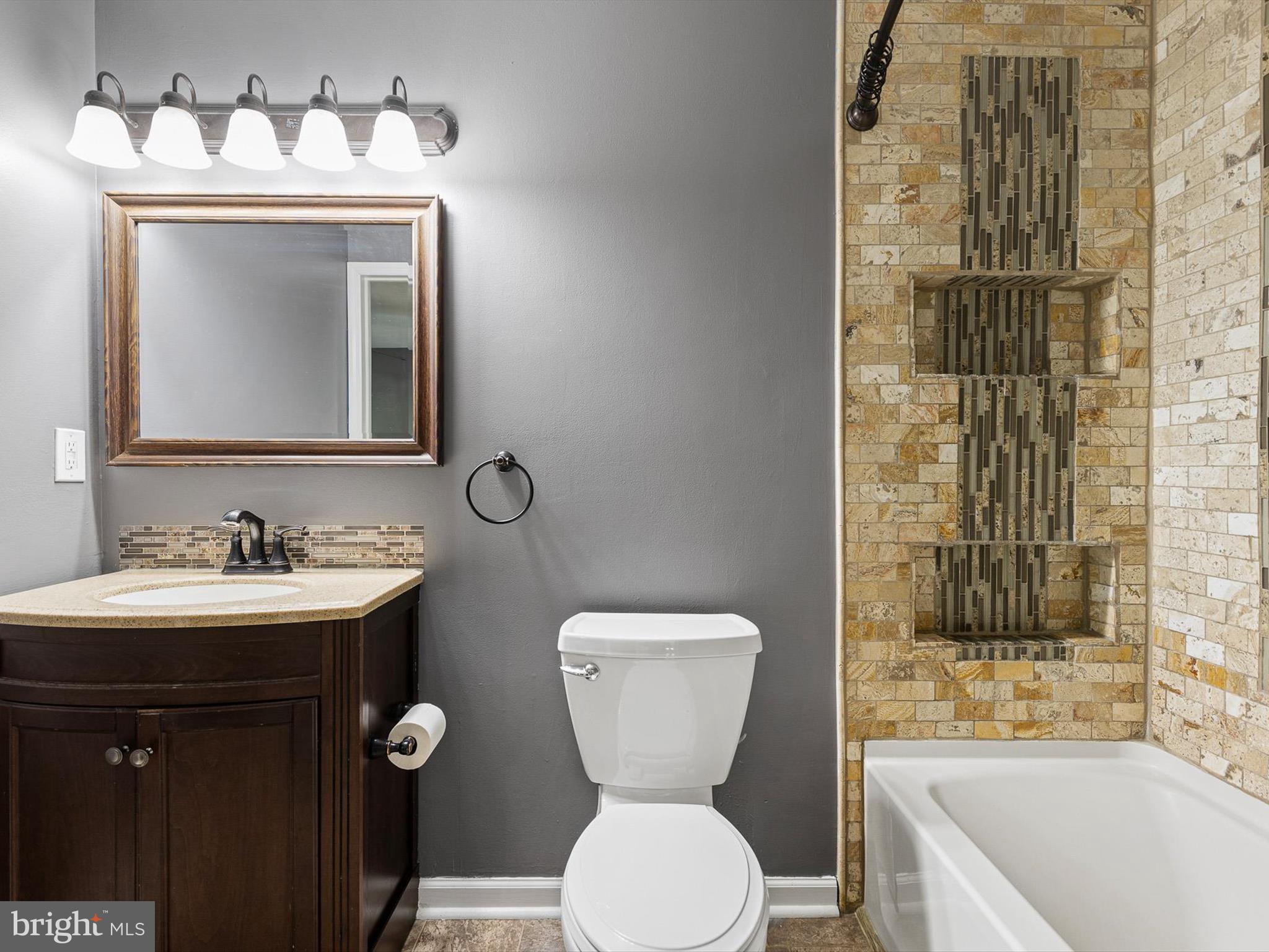 34 Dovetree Drive Newark, DE 19713 - Photo 17 of 29 a bathroom with a toilet sink and mirror