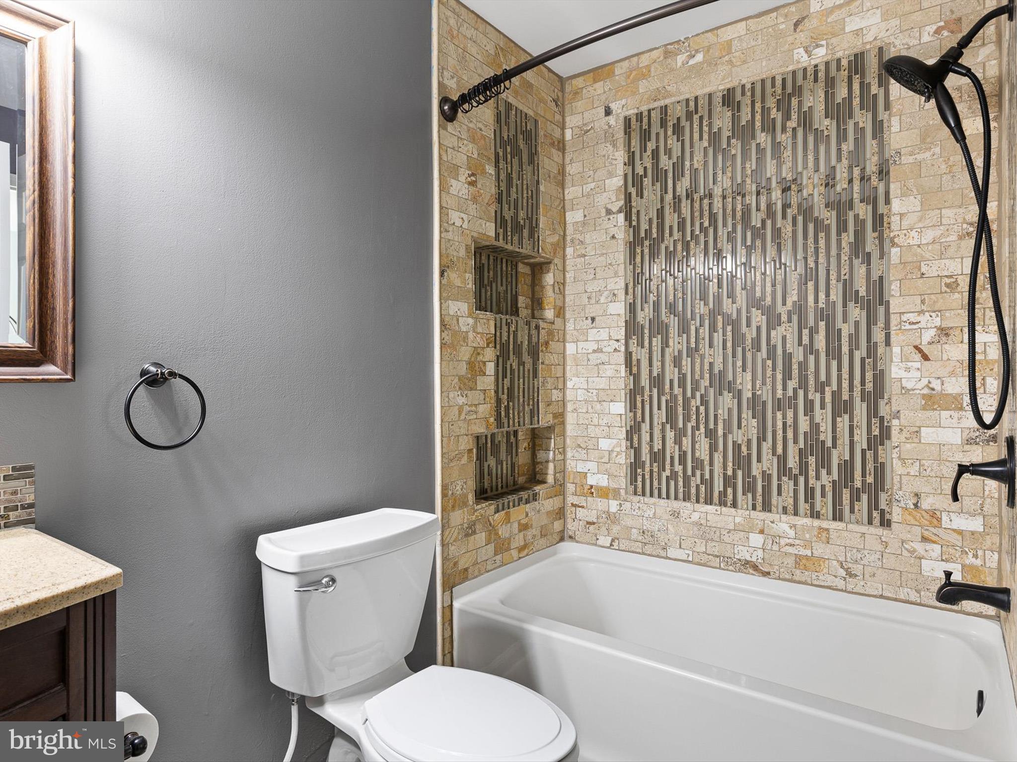 34 Dovetree Drive Newark, DE 19713 - Photo 18 of 29 a bathroom with a toilet and a bathtub