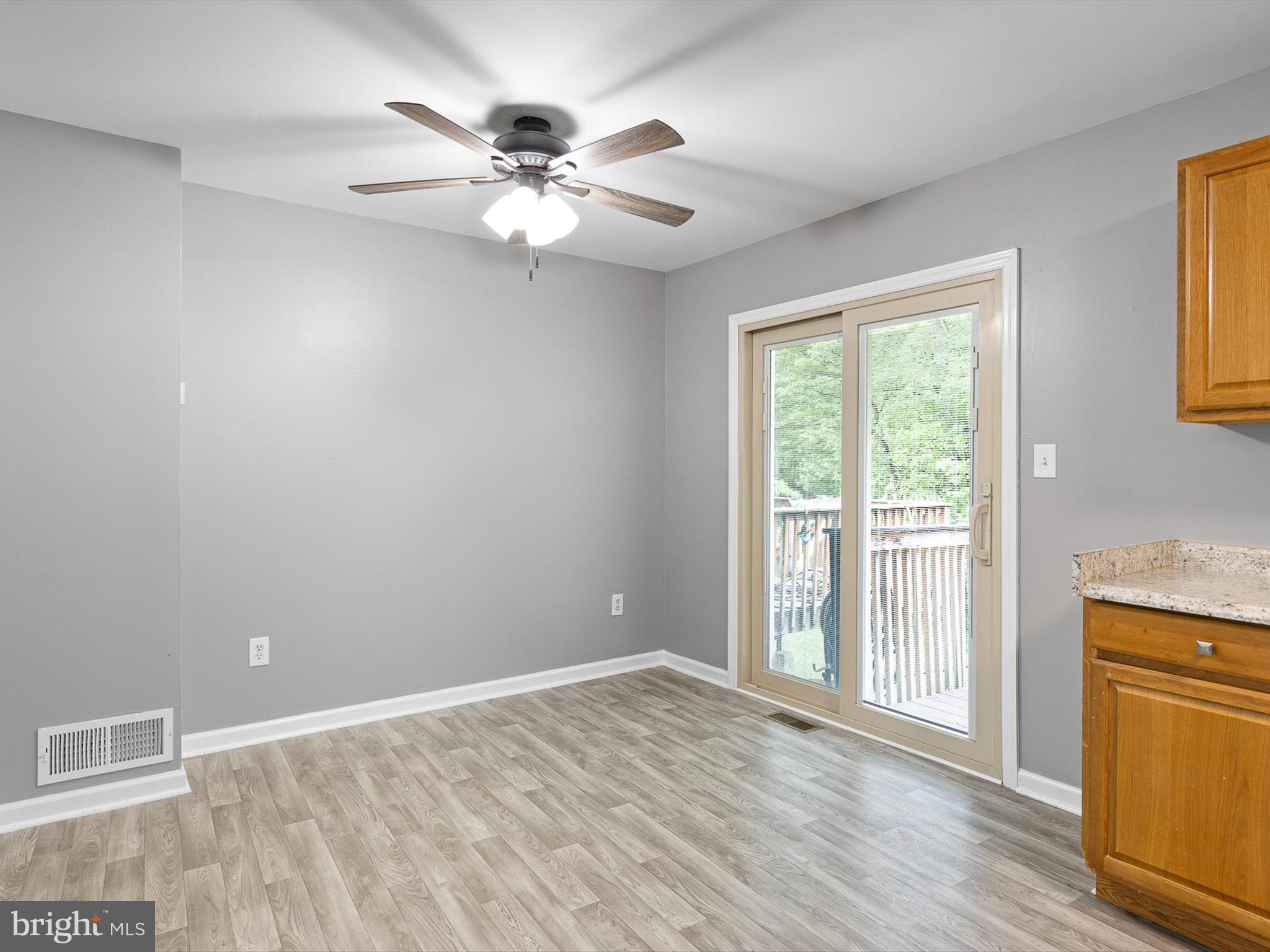 34 Dovetree Drive Newark, DE 19713 - Photo 21 of 29 a view of an empty room with a window and wooden floor