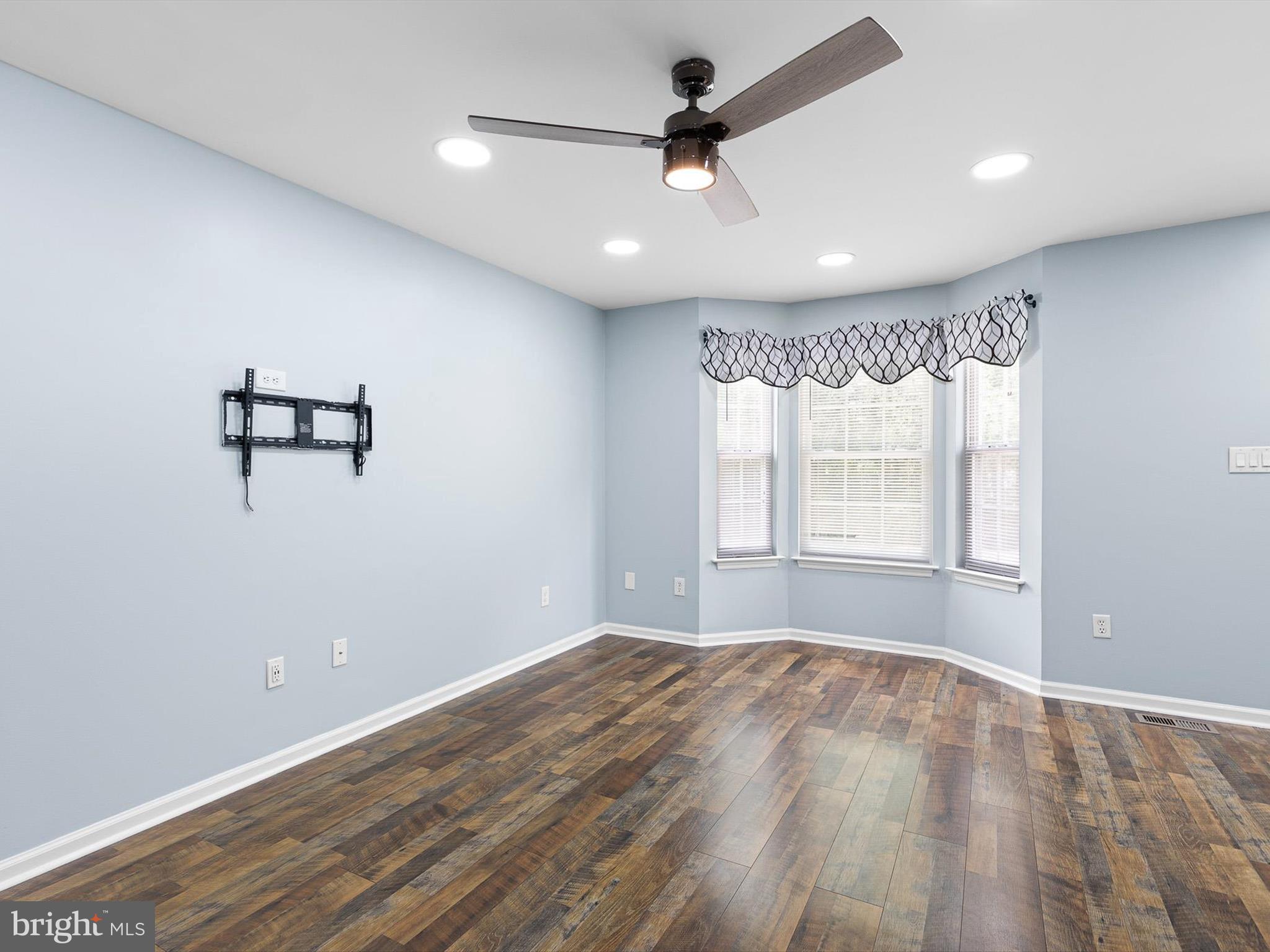 34 Dovetree Drive Newark, DE 19713 - Photo 24 of 29 a view of empty room with wooden floor and fan
