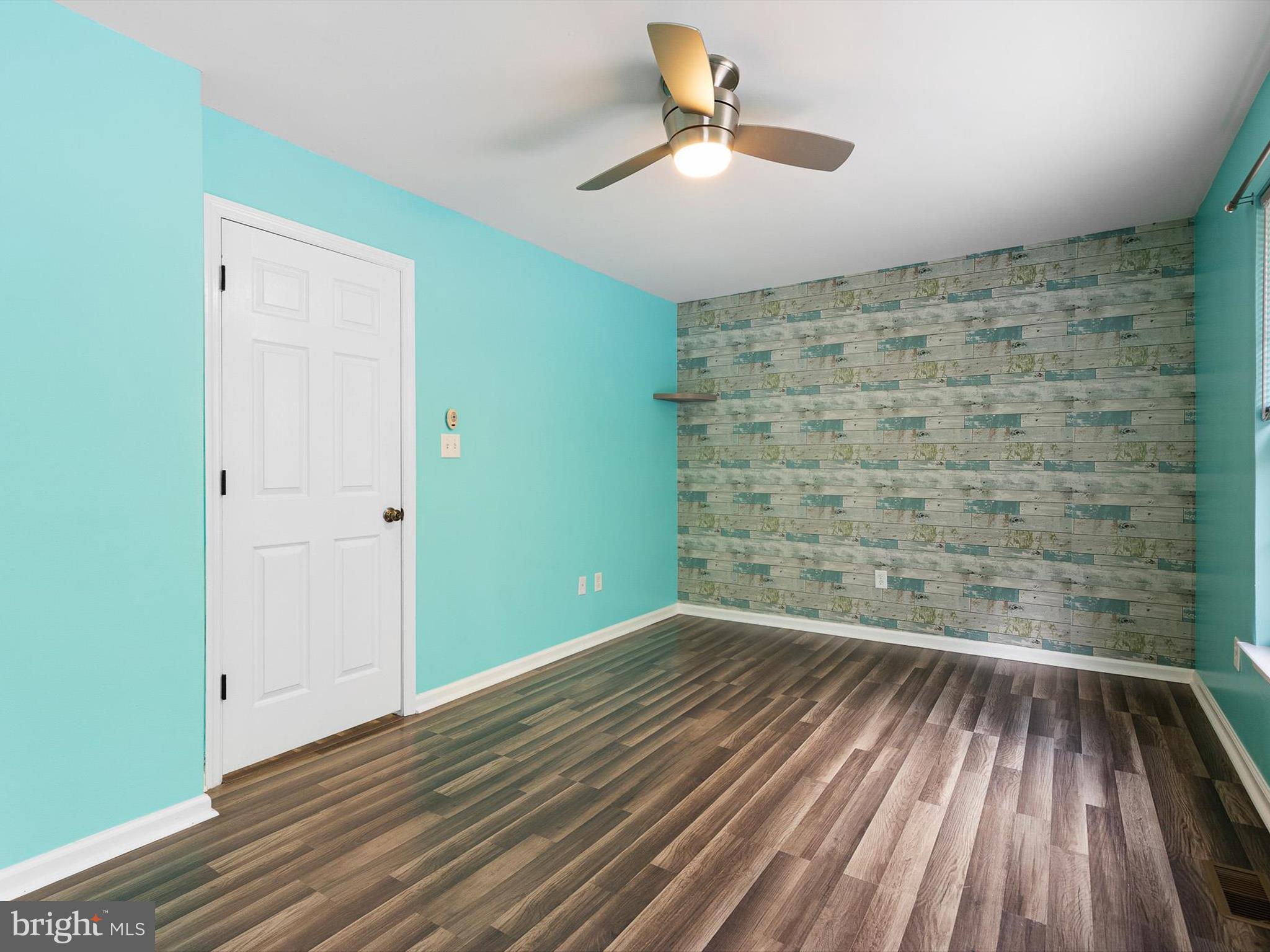 34 Dovetree Drive Newark, DE 19713 - Photo 10 of 29 a view of an empty room with wooden floor