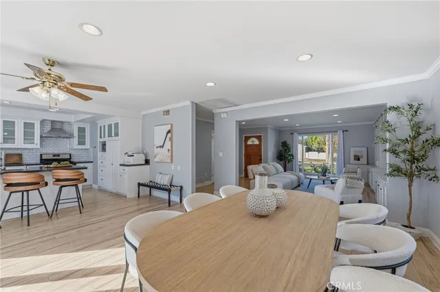 a dining room with furniture and wooden floor