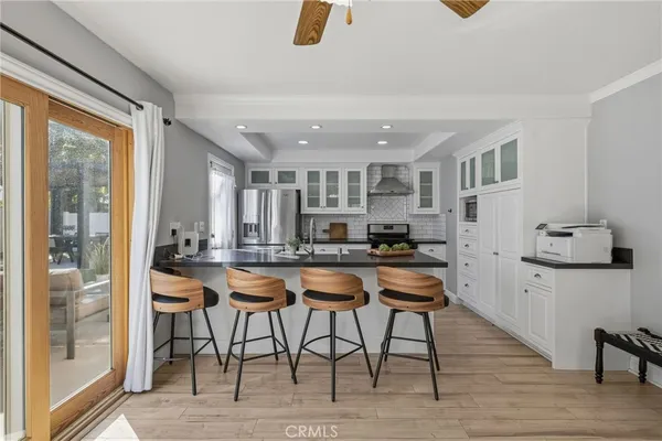 a kitchen with sink stove and cabinets