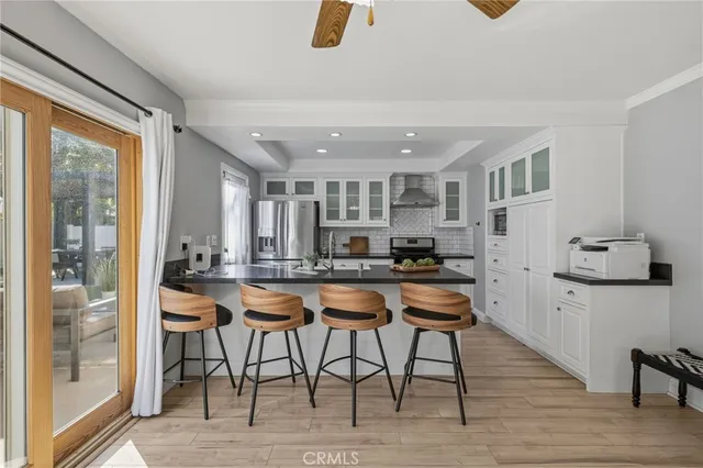a kitchen with sink stove and cabinets