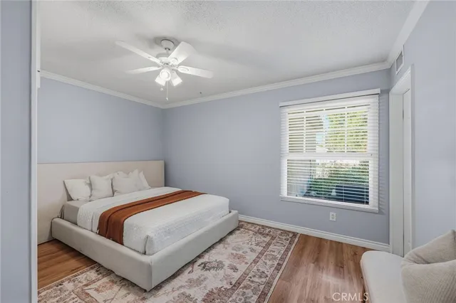 a bedroom with a bed and cabinets
