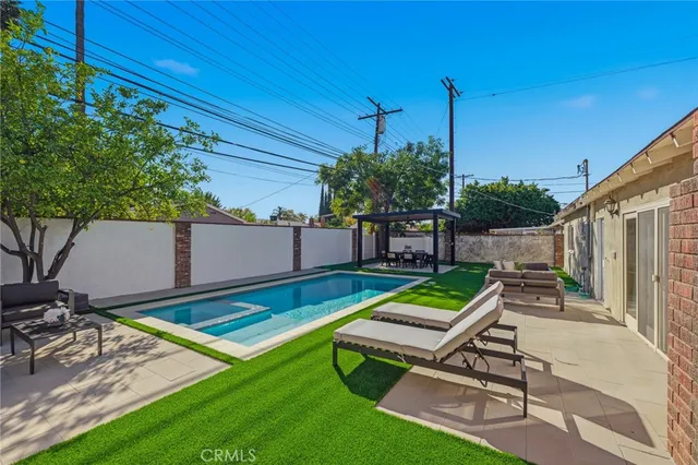 a view of a livingroom with furniture and wooden door