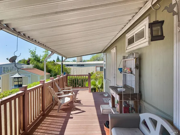 a view of balcony with furniture