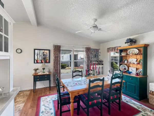 a dining room with furniture and window