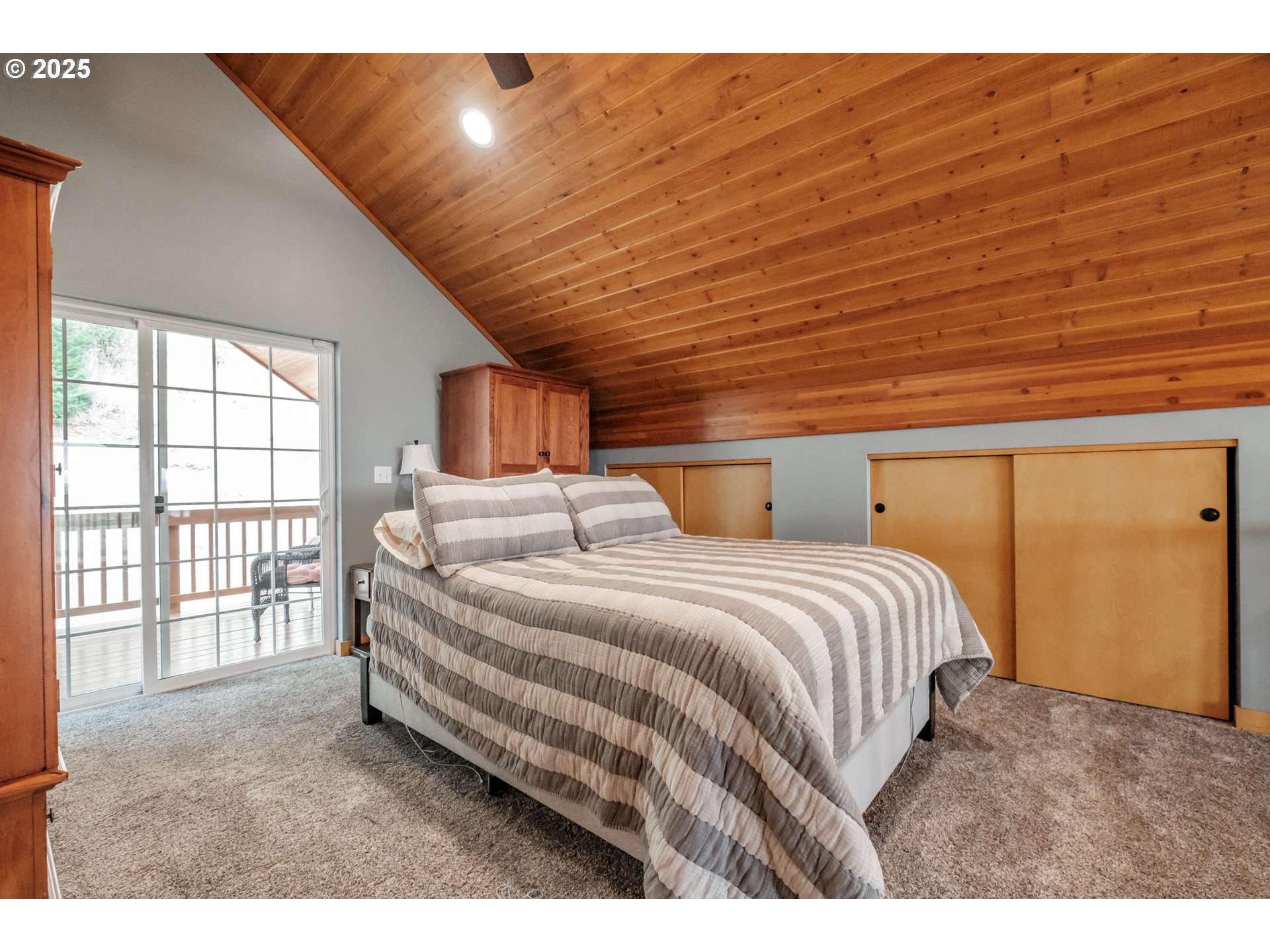 29109 Brownsville Road Brownsville, OR 97327 - Photo 26 of 40 a spacious bedroom with a bed and a large window