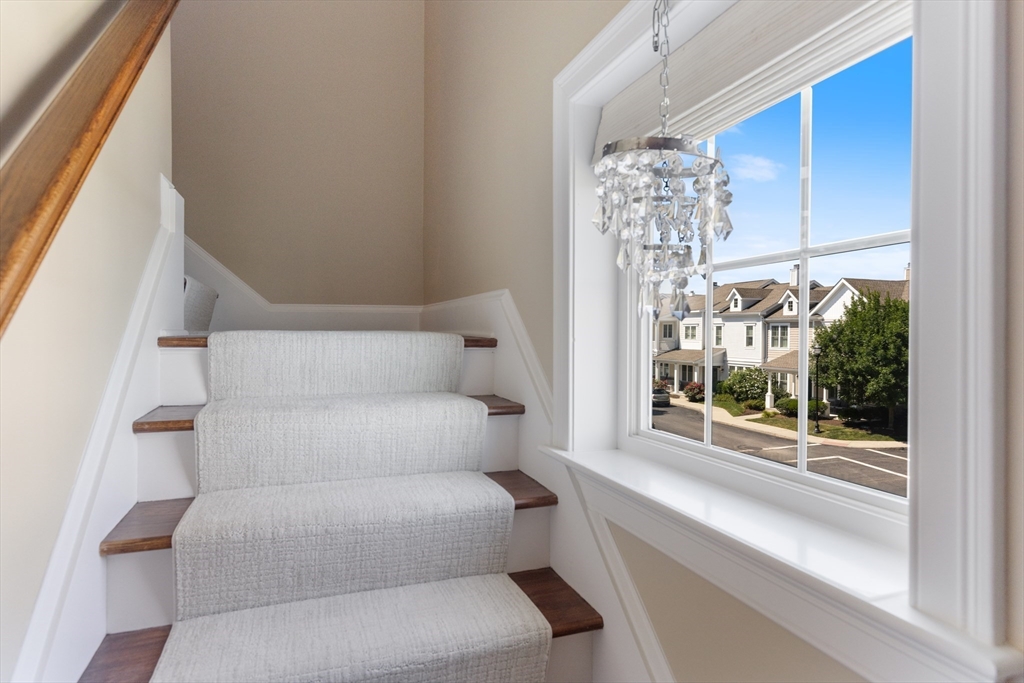 151 HMS Halsted Drive, Unit 151 Hingham, MA 02043 - Photo 11 of 41 a living room with furniture and a window