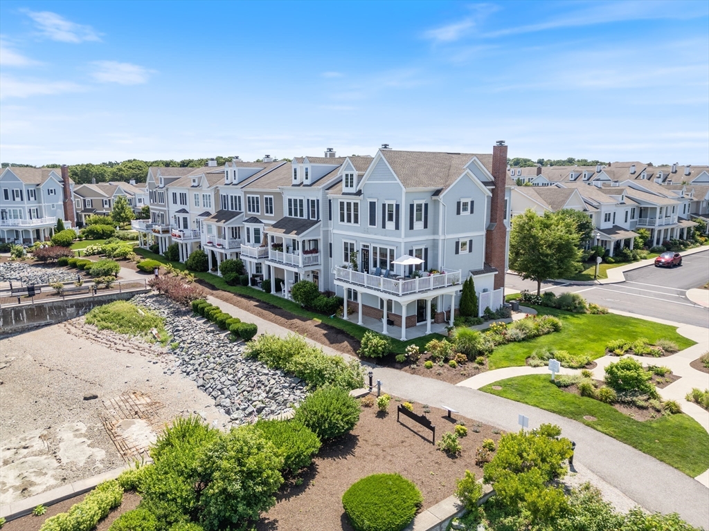 151 HMS Halsted Drive, Unit 151 Hingham, MA 02043 - Photo 12 of 41 a view of a lake with a building in the background