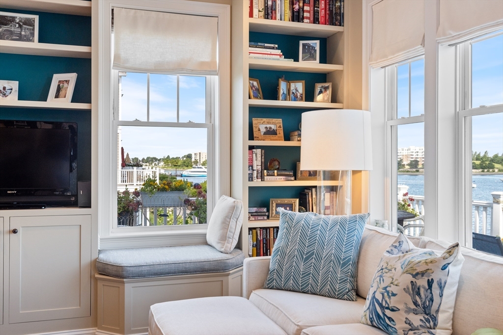 151 HMS Halsted Drive, Unit 151 Hingham, MA 02043 - Photo 14 of 41 a living room with furniture and a book shelf