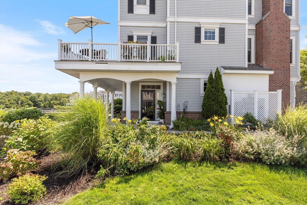 151 HMS Halsted Drive, Unit 151 Hingham, MA 02043 - Photo 17 of 41 a front view of a house with a yard