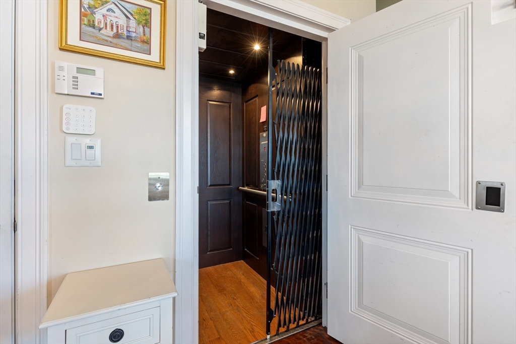 151 HMS Halsted Drive, Unit 151 Hingham, MA 02043 - Photo 19 of 41 a bathroom with a glass shower door
