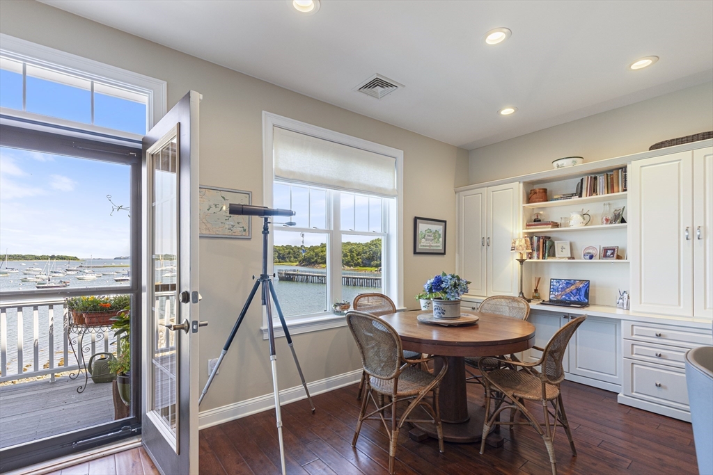 151 HMS Halsted Drive, Unit 151 Hingham, MA 02043 - Photo 20 of 41 a view of a dining room with furniture window and wooden floor