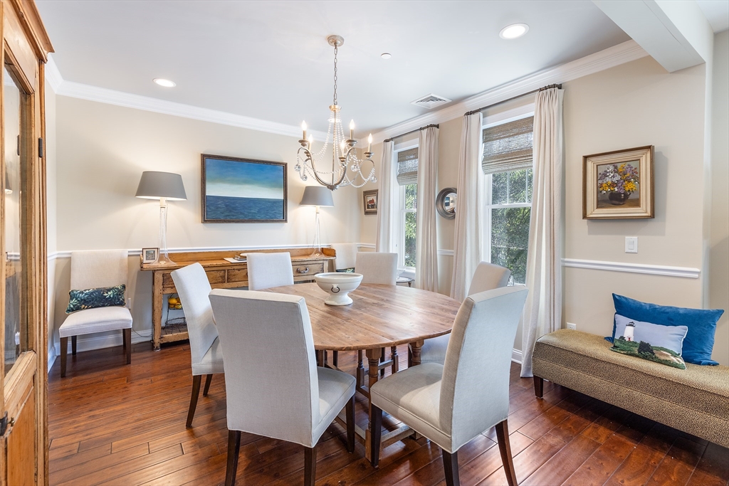 151 HMS Halsted Drive, Unit 151 Hingham, MA 02043 - Photo 24 of 41 a view of a dining room with furniture wooden floor and chandelier