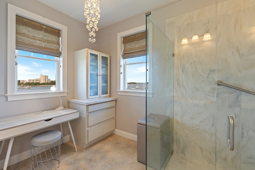 151 HMS Halsted Drive, Unit 151 Hingham, MA 02043 - Photo 31 of 41 a bathroom with a sink and a mirror