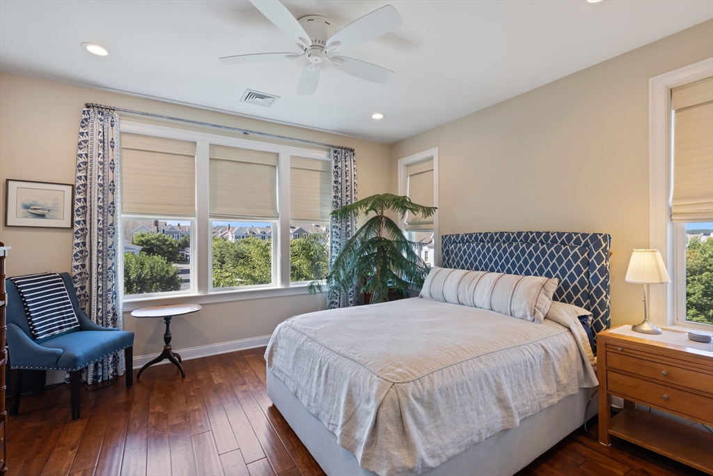 151 HMS Halsted Drive, Unit 151 Hingham, MA 02043 - Photo 34 of 41 a bedroom with a large bed and a large window