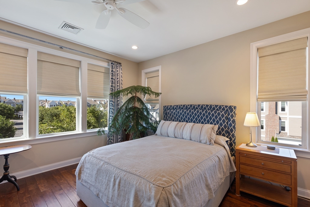 151 HMS Halsted Drive, Unit 151 Hingham, MA 02043 - Photo 35 of 41 a bedroom with a large bed and a window