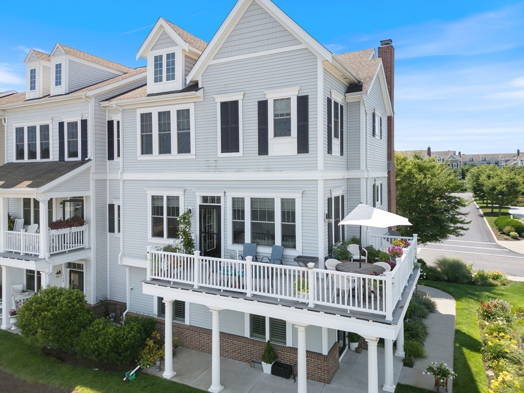 151 HMS Halsted Drive, Unit 151 Hingham, MA 02043 - Photo 6 of 41 a front view of a house with a porch