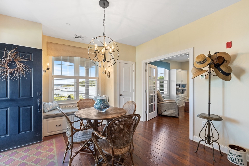 151 HMS Halsted Drive, Unit 151 Hingham, MA 02043 - Photo 8 of 41 a view of a dining room with furniture window and wooden floor