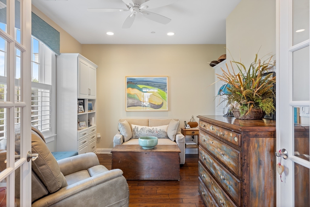 151 HMS Halsted Drive, Unit 151 Hingham, MA 02043 - Photo 10 of 41 a living room with furniture and a potted plant