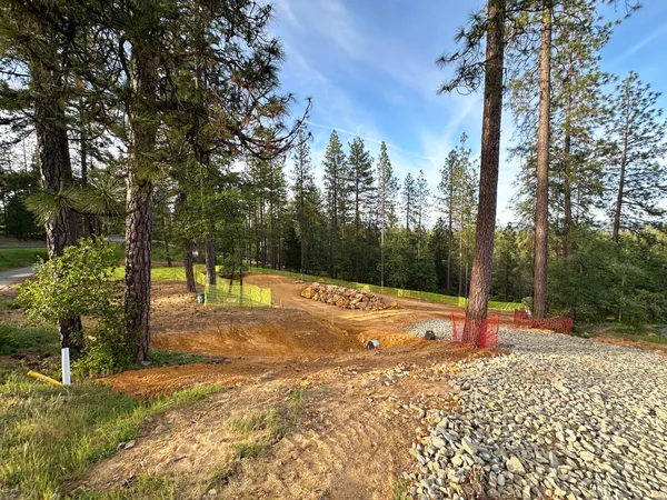 a view of a backyard with sitting area