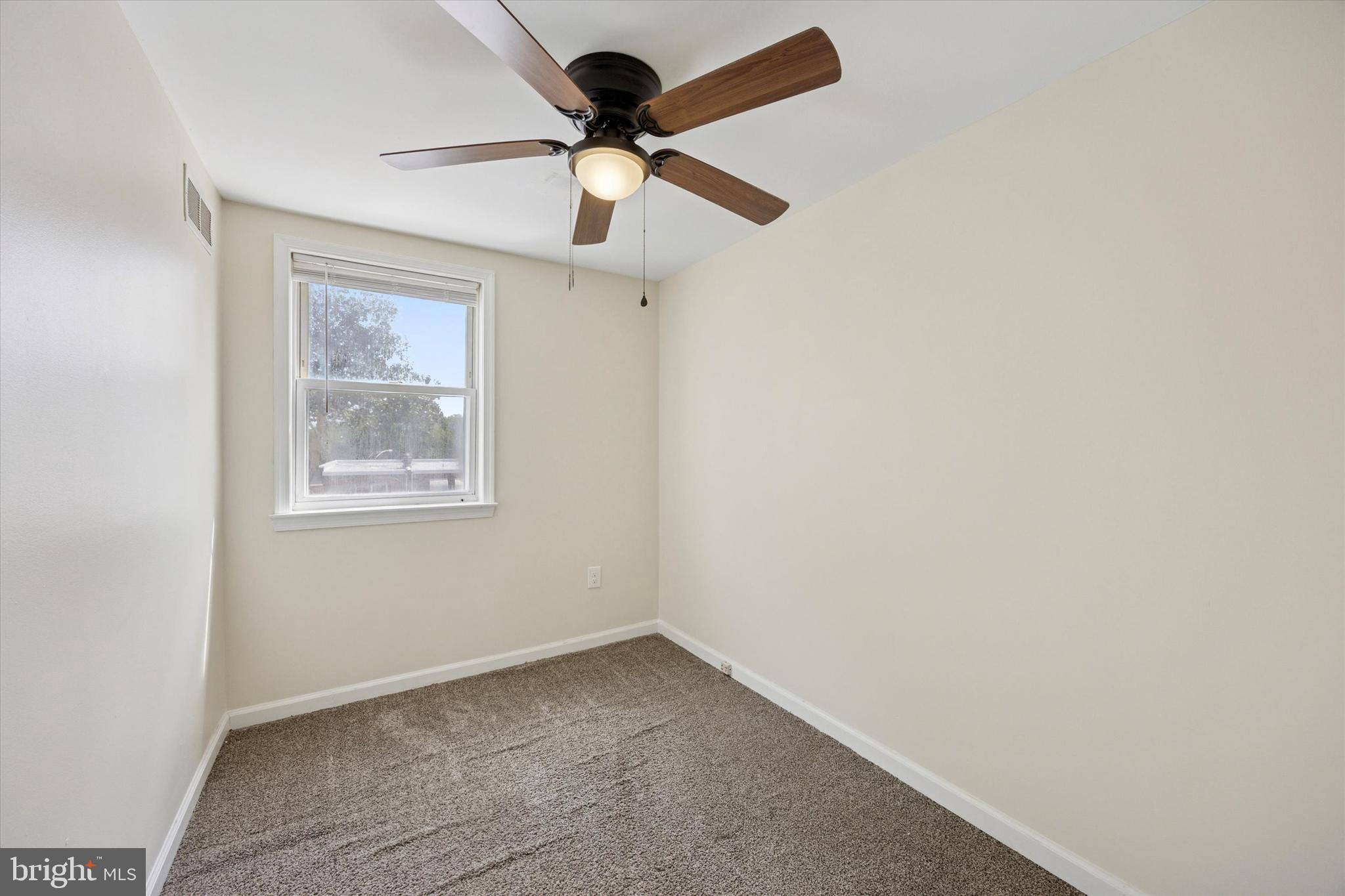 723 Bennington Road Folcroft, PA 19032 - Photo 16 of 25 an empty room with a window and a fan