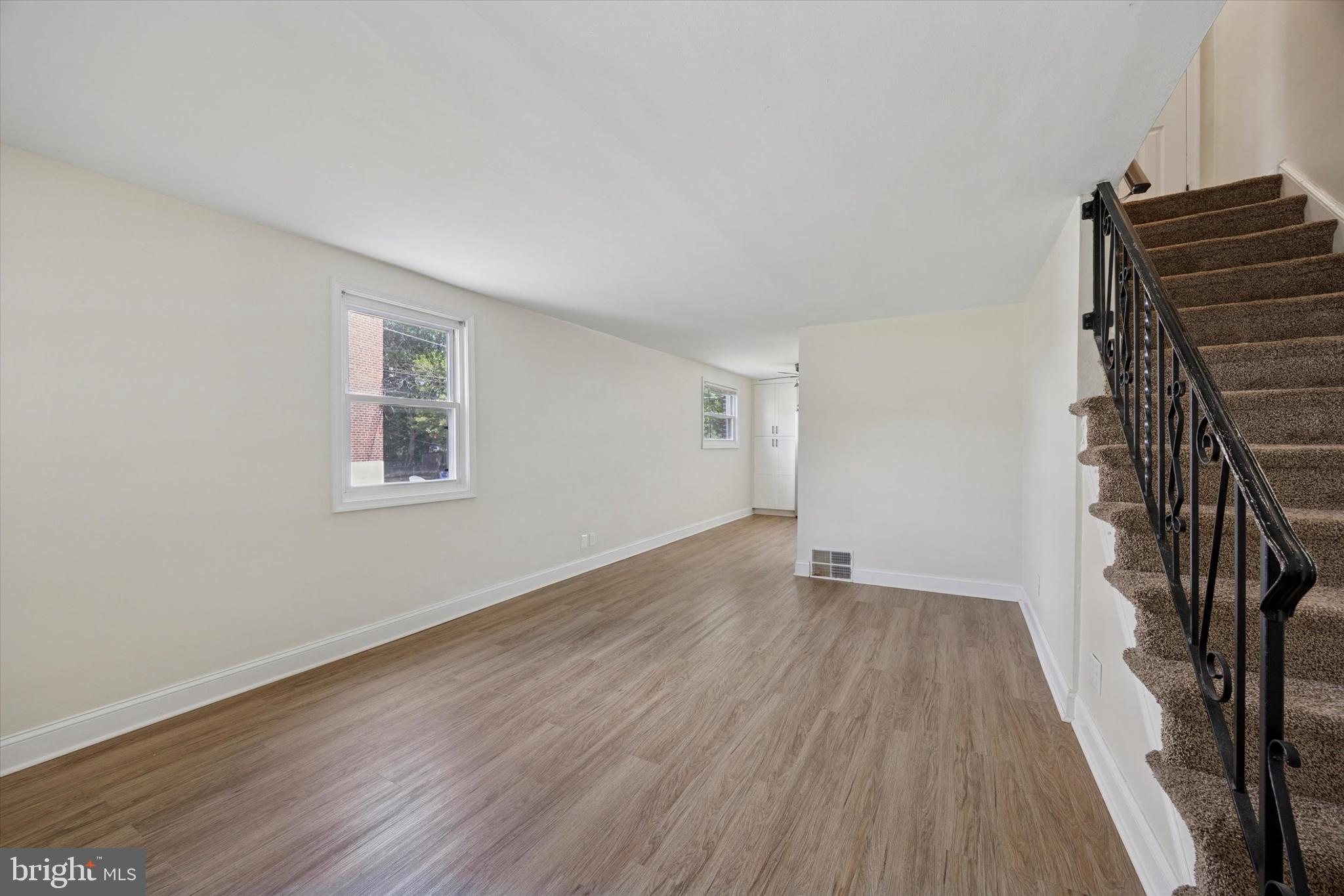 723 Bennington Road Folcroft, PA 19032 - Photo 4 of 25 wooden floor in an empty room with a window
